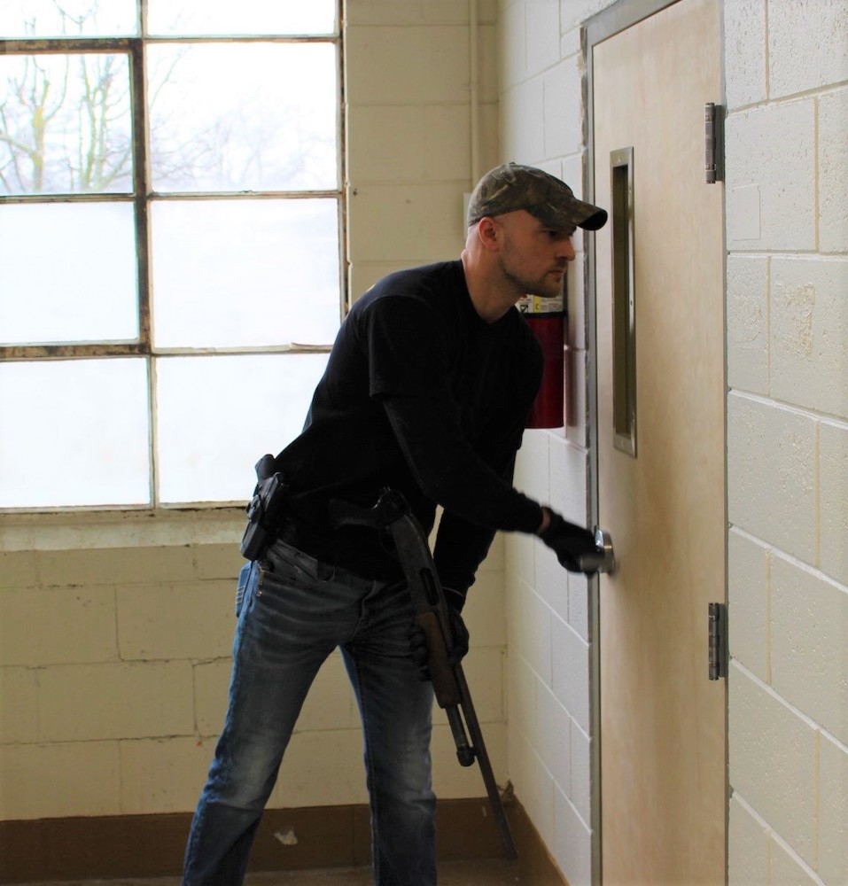 Police Officer Testing Nightlock Lockdown devices for Classroom Door Security